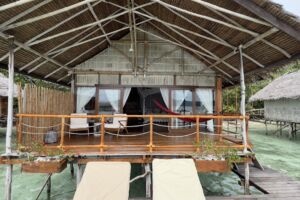 Papua Explorers over water bungalow with its private sundeck and sunloungers