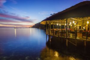 (English) ambiance of our restaurant in Raja Ampat with a colorful evening sky